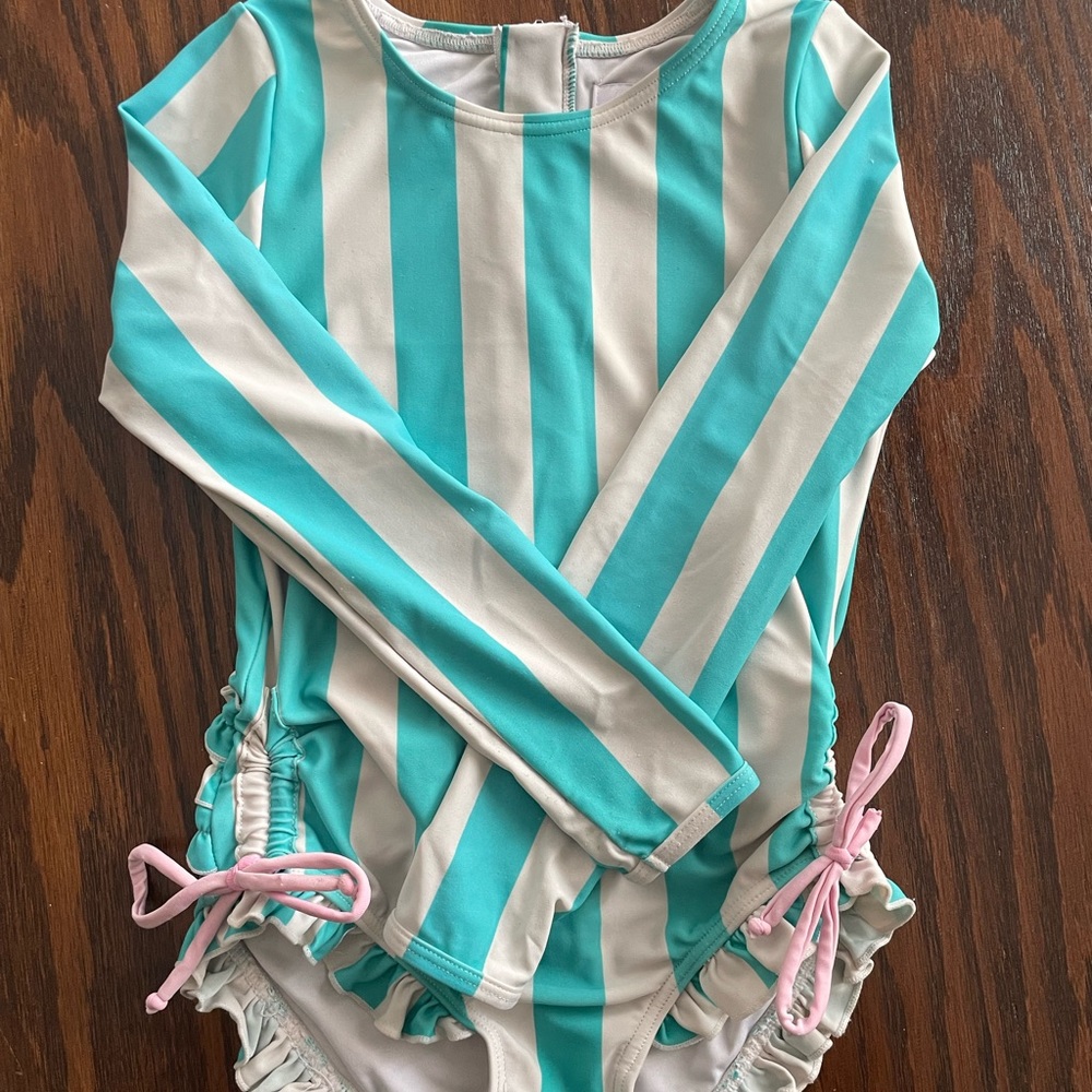 Seeethoney long sleeve bathing suit. Very washed out from sun, chlorine, etc.